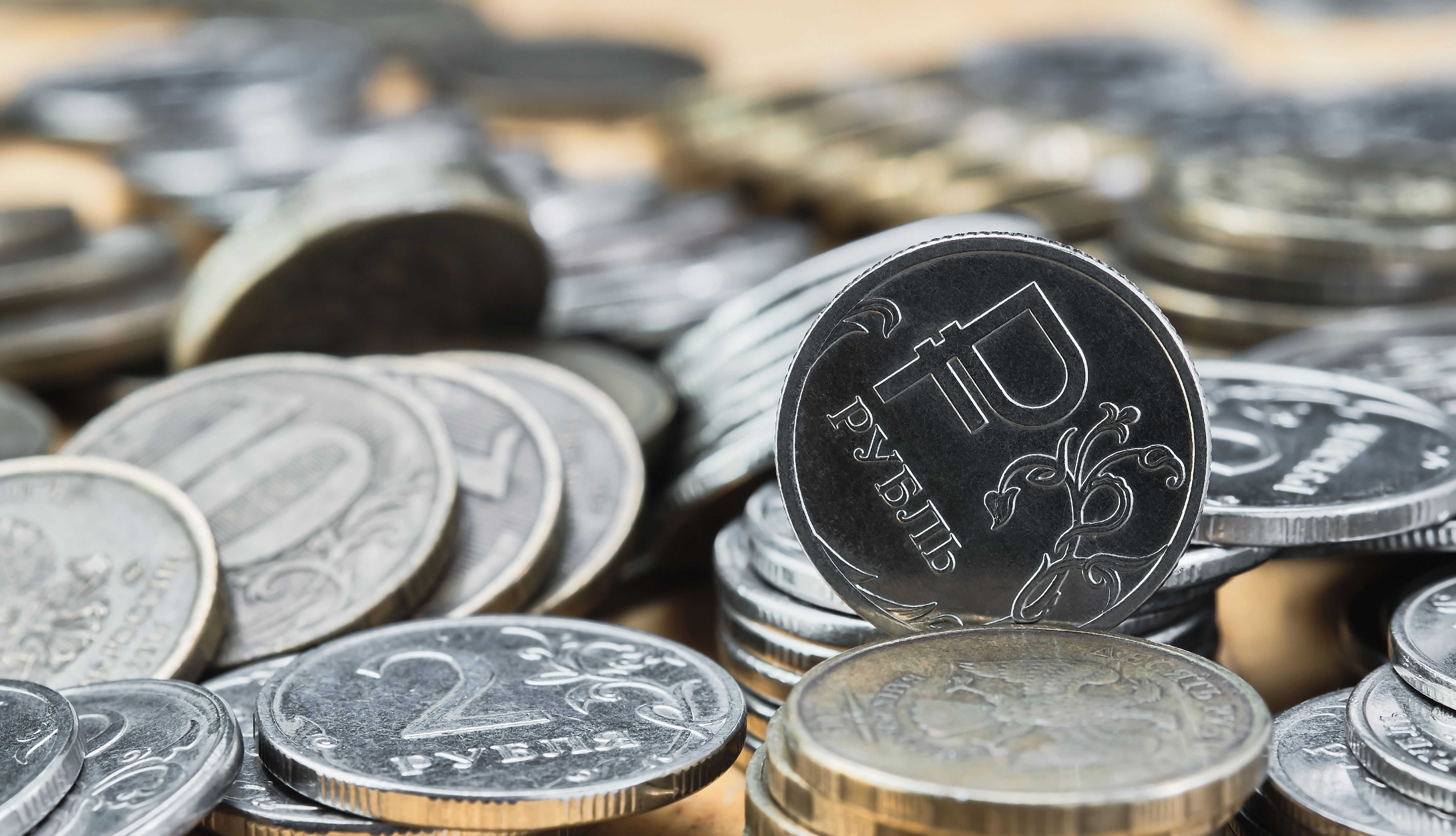 background-blurry-out-focus-bokeh-pasteurization-coins-russian-ruble-table-change-exchange-rate-ruble-idea-economic-news-banner.jpg